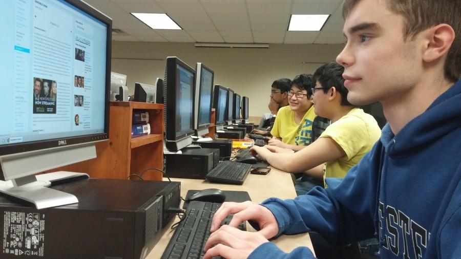 Students run through lines of code in RHSs new programming class