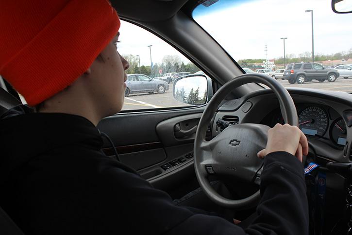 Sophomore Tom Hawes focused on driving out of the parking lot. 