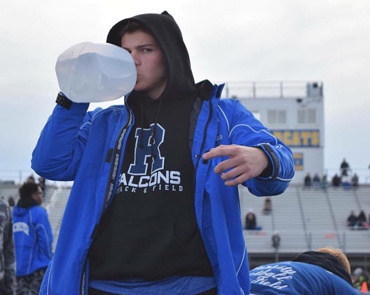 Junior Brandon Wright hydrates at track meet with his jug. Image courtesy of Brandon Wright.