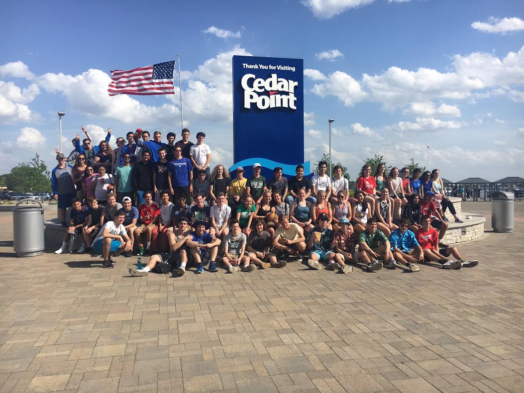 Students on the field trip pose in front of the entrance to the park.