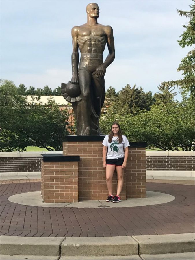 Senior Grace Murphy visits the MSU Sparty statue during her college visit. Photo courtesy of Grace Murphy.