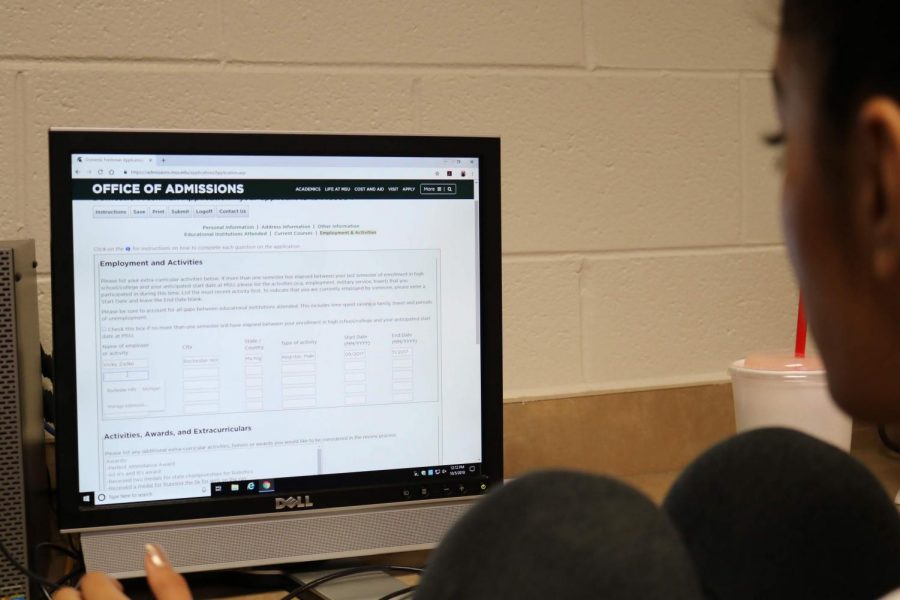 Senior Pooja Patel works on her college application. Students and parents can learn more about the application process during College Night at AHS on Oct. 16. Photo by Maggie Rhymstett 