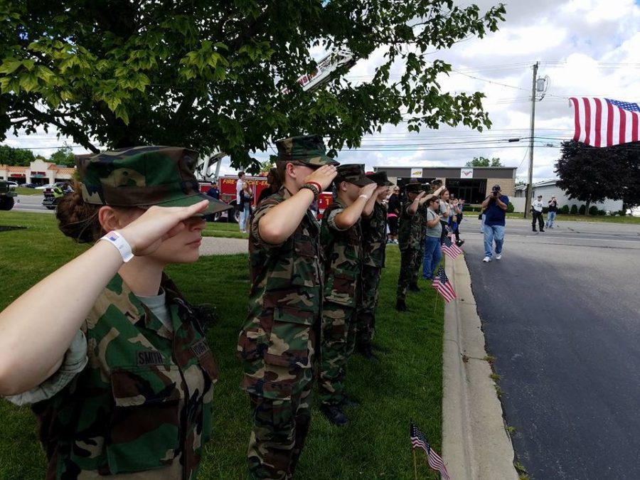 Senior Maya Smith salutes in her Young Marines Program. Photo courtesy of Maya Smith.