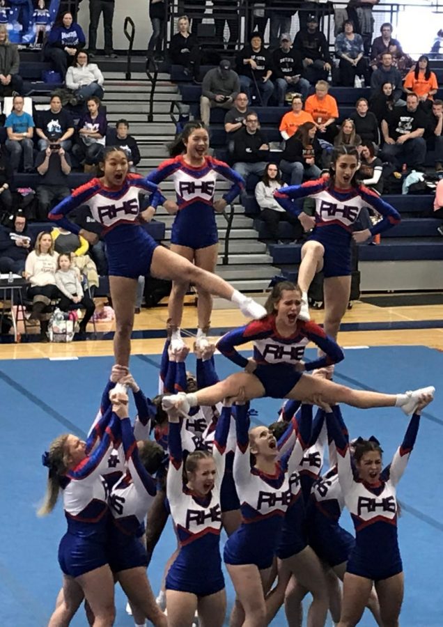 The Varsity Cheer Team at one of their last competitions. Photo  by Mariam Hanna.