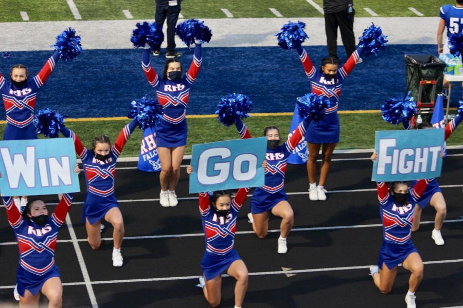 The RHS Varsity Cheer Team practices social distancing and use of masks while cheering under the Friday night lights.
Photo courtesy of: Janet Olivares
